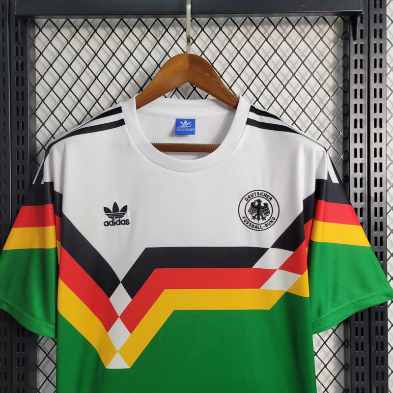 Camisa Alemanha Home I 1990/91 Adidas Retrô Masculina branca com detalhes em preto, vermelho e amarelo – modelo clássico de colecionador, ideal para torcedores e fãs de camisas históricas de futebol.
