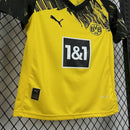 Kit Infantil Borussia Dortmund Home 2025/26 Puma com camisa amarela e short preto, escudo do clube e logo Puma