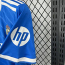 Camisa Real Madrid Third 2025/26 Adidas Torcedor Masculina azul, modelo com escudo do clube e design moderno, disponível na Wazemix