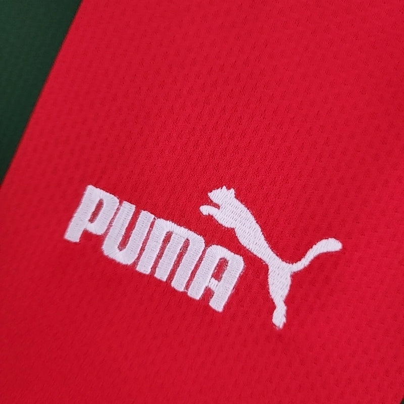 Camisa Marrocos 2022/23 Home I Torcedor Masculina - modelo vermelho, uniforme principal da seleção marroquina, escudo em destaque e design clássico para os torcedores.