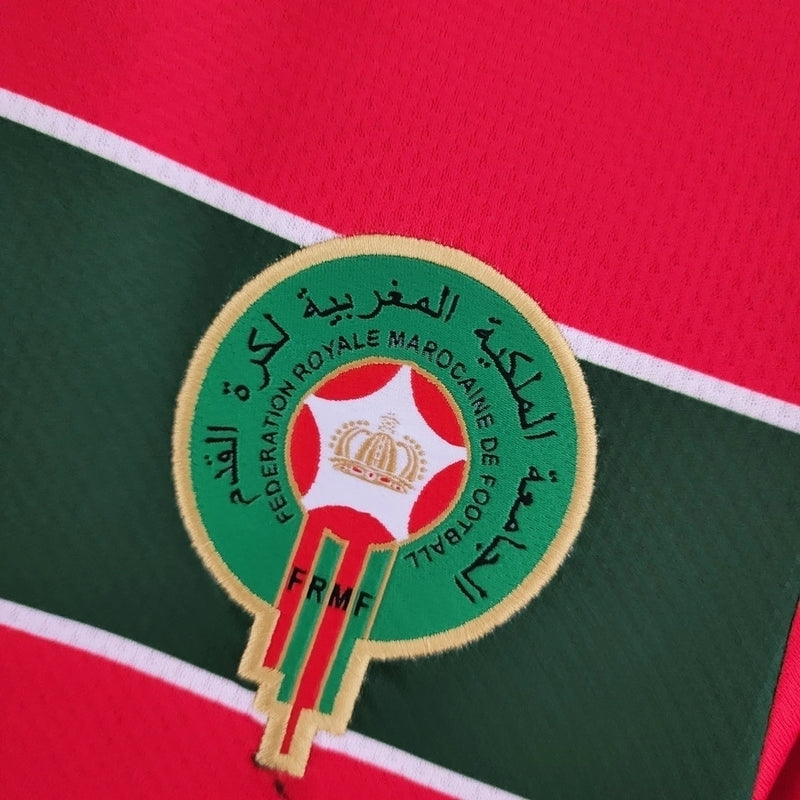 Camisa Marrocos 2022/23 Home I Torcedor Masculina - modelo vermelho, uniforme principal da seleção marroquina, escudo em destaque e design clássico para os torcedores.