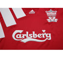 Camisa Liverpool Home I Especial 100 Anos 1982/83 Adidas Retrô Masculina - modelo vermelho, edição comemorativa do centenário do clube, com escudo em destaque e design clássico que celebra a história do Liverpool.