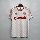 Camisa Retrô Liverpool Away II 1989/91 Adidas Torcedor Masculina - modelo cinza, uniforme de visitante clássico da temporada, com escudo em destaque e design nostálgico que celebra a história e tradição do clube inglês.