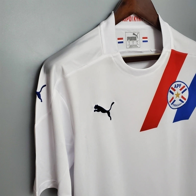 Compre a Camisa paraguai away 2020/21 Puma Torcedor masculina branca com detalhes vermelho e azul