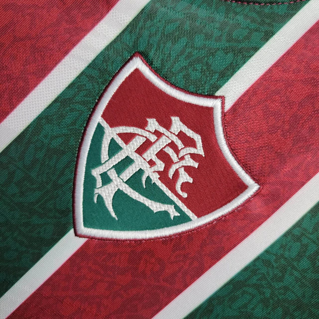 Camisa Fluminense Home 2024/25 Torcedora Feminina oficial com listras verde, grená e branco, escudo bordado, modelo moderno e confortável