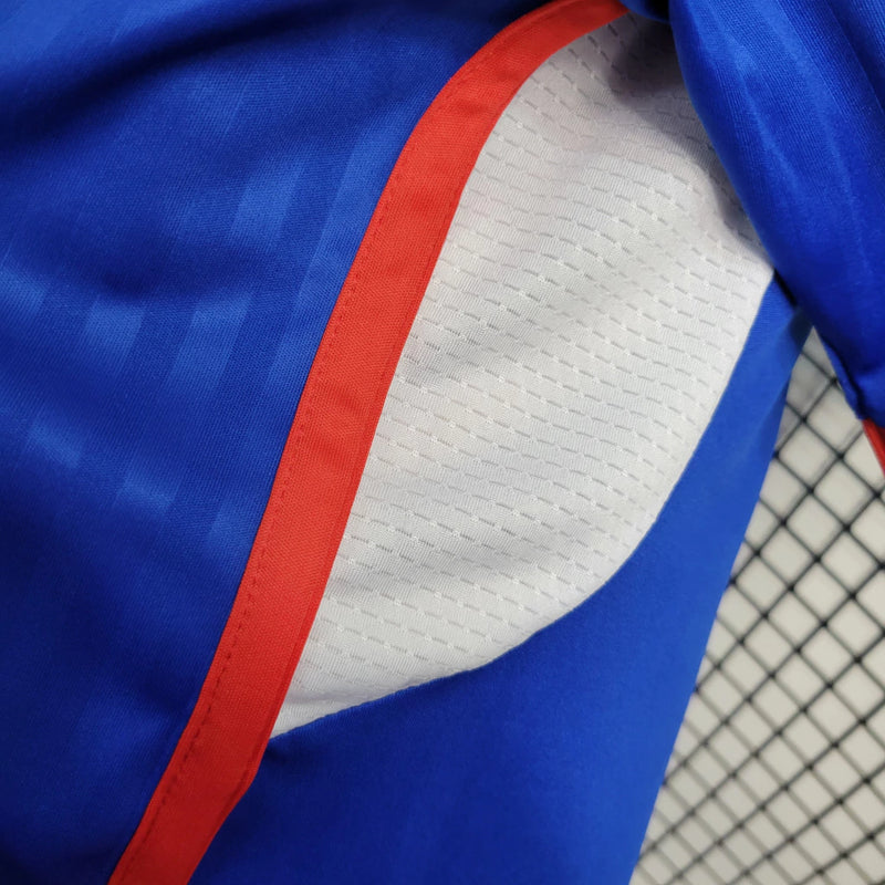 Camisa Universidad de Chile Home 2023/24 masculina azul, torcedor Adidas, uniforme futebol La U, camiseta oficial torcida, tecido respirável Climacool, design moderno e escudo do clube destacado"