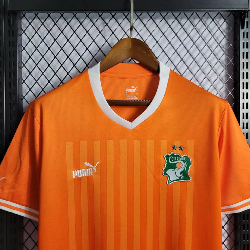 Camisa Costa do Marfim Home I 2022/23 Puma Torcedor Masculina na cor laranja – uniforme oficial dos Elefantes, modelo torcedor, tecido leve e respirável, disponível na Waze Mix."Camisa Costa do Marfim Home 2022
Camisa Costa do Marfim Puma
Camisa Costa do Marfim Laranja
Camisa Elefantes 2022/23
Camisa Costa do Marfim Torcedor Masculina
Uniforme Costa do Marfim Puma
Camisa seleção Costa do Marfim 2022
Camisa oficial Costa do Marfim