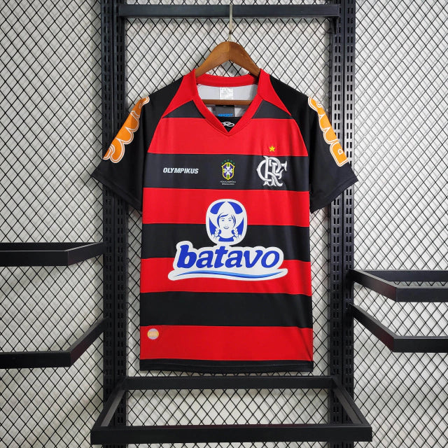 Camisa Flamengo Home I 2010/11 Olympikus vermelha e preta com listras horizontais, leve e respirável, ideal para torcedores Rubro-Negros e colecionadores de camisas históricas."