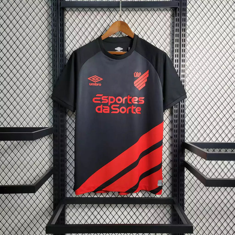 Camisa Athletico Paranaense Away (2) 2023/24 Umbro Torcedor Masculina com escudo oficial bordado e logo Umbro estampado, modelo visitante do clube paranaense.