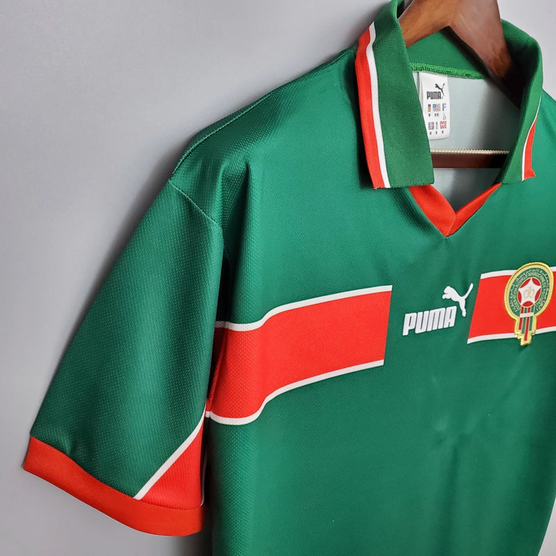 Camisa Marrocos Home I 1998/99 Puma Retrô Masculina verde, modelo clássico dos Leões do Atlas dos anos 90, design nostálgico e histórico para colecionadores e fãs de futebol retrôCamisa Marrocos Retrô
Camisa Marrocos 1998/99
Camisa Puma Marrocos antiga
Camisa Marrocos verde retrô
Camisa Marrocos Home 1998
Camisa retrô masculina Marrocos
Camisa de futebol retrô Marrocos
Camisa clássica Marrocos 1999
Camisa Leões do Atlas retrô