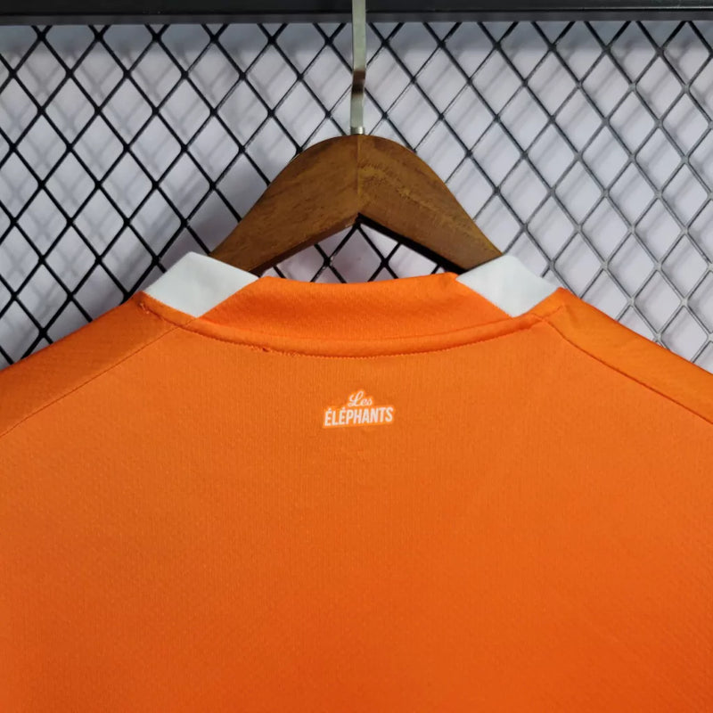 Camisa Costa do Marfim Home I 2022/23 Puma Torcedor Masculina na cor laranja – uniforme oficial dos Elefantes, modelo torcedor, tecido leve e respirável, disponível na Waze Mix."Camisa Costa do Marfim Home 2022
Camisa Costa do Marfim Puma
Camisa Costa do Marfim Laranja
Camisa Elefantes 2022/23
Camisa Costa do Marfim Torcedor Masculina
Uniforme Costa do Marfim Puma
Camisa seleção Costa do Marfim 2022
Camisa oficial Costa do Marfim