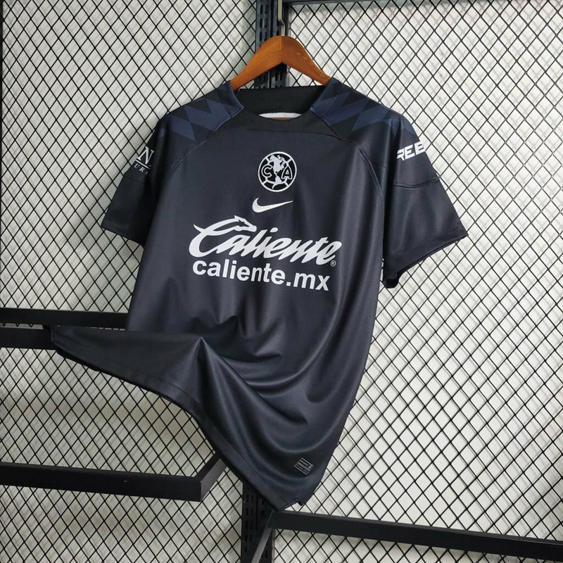 Camisa Club América Treino 2023/24 Torcedor Masculina Preta Nike, uniforme de treino leve e confortável, futebol mexicano, estilo esportivo para torcedores"