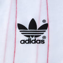 Camisa Polônia Home I 1982/83 Adidas Retrô Masculina, branca, com escudo da seleção polonesa e logo Adidas bordados, feita em tecido leve e confortável, modelo retrô masculino com caimento tradicional, ideal para colecionadores e uso casual.”