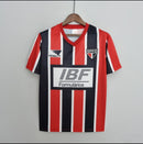 Camisa retrô masculina do São Paulo FC modelo Away II da temporada 1991/1992, fabricada pela Penalty, com design clássico dos anos 90, nas cores branca, vermelha e preta, escudo antigo do clube no peito e estilo vintage colecionável.