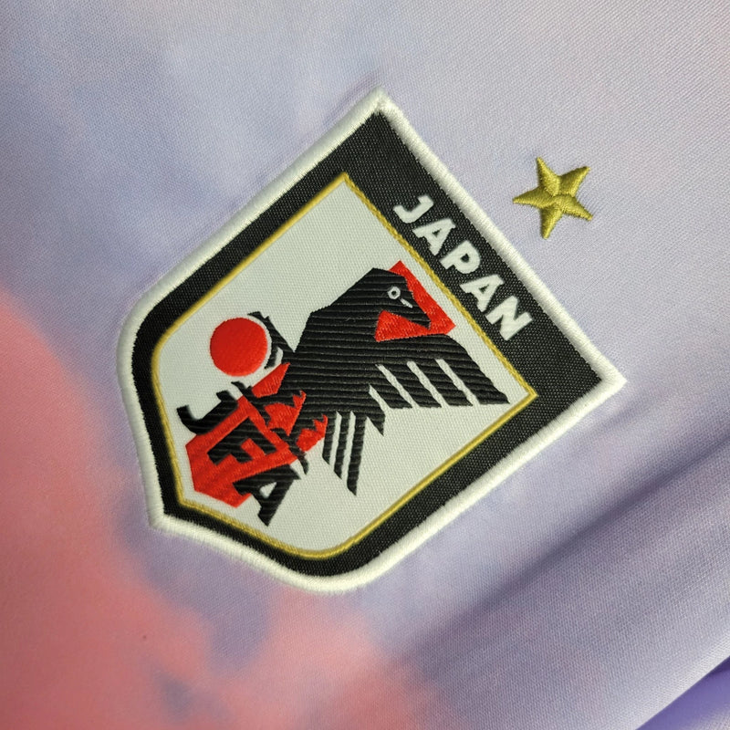 Camisa Japão Away II 2023/24 Adidas Torcedora Feminina Rosa – uniforme alternativo da seleção japonesa em tecido leve com tecnologia AEROREADY, disponível do tamanho PP ao GG, ideal para torcedoras, treinos e coleção.