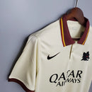 Camisa Roma Away II 2020/21 Nike Retrô Masculina marfim, com detalhes em bordô e dourado, gola polo e escudo bordado da Roma.