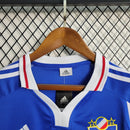 Camisa Iugoslávia 2000/01 Adidas retrô masculina azul com detalhes em branco e vermelho, gola polo com botão e mangas curtas, modelo clássico em tecido leve para torcedores e colecionadores"