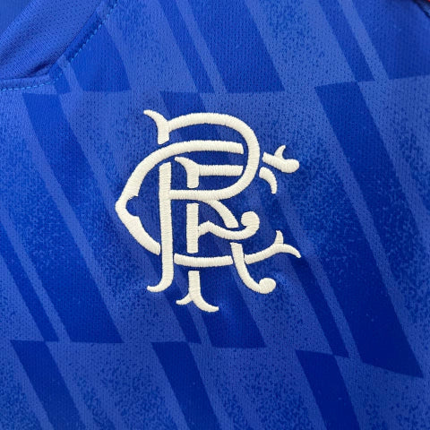 Camisa Rangers Home I 2024/25 Castore Torcedor Masculina Azul, design moderno com detalhes clássicos, conforto e tradição para torcedores do Rangers FC.”