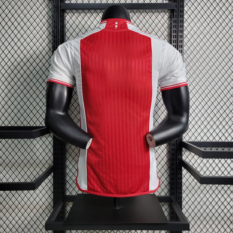 Camisa Ajax Home (1) 2023/24 Adidas Jogador Masculina original, modelo Player Issue branco com faixa vermelha central, tecnologia HEAT.RDY, versão oficial usada pelos atletas."