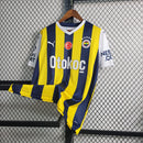 Camisa Fenerbahçe Home I 2023/24 Puma masculina em amarelo e azul, com escudo bordado e tecido respirável dryCELL, ideal para torcer e jogar futebol com conforto."