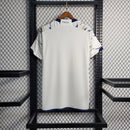 Camisa Itália Away II 2023/24 Adidas Torcedor masculina, off white, com escudo da seleção italiana no peito e três listras Adidas nos ombros, feita em tecido leve e respirável, modelo com caimento torcedor mais solto e confortável, ideal para torcer com estilo e autenticidade.”