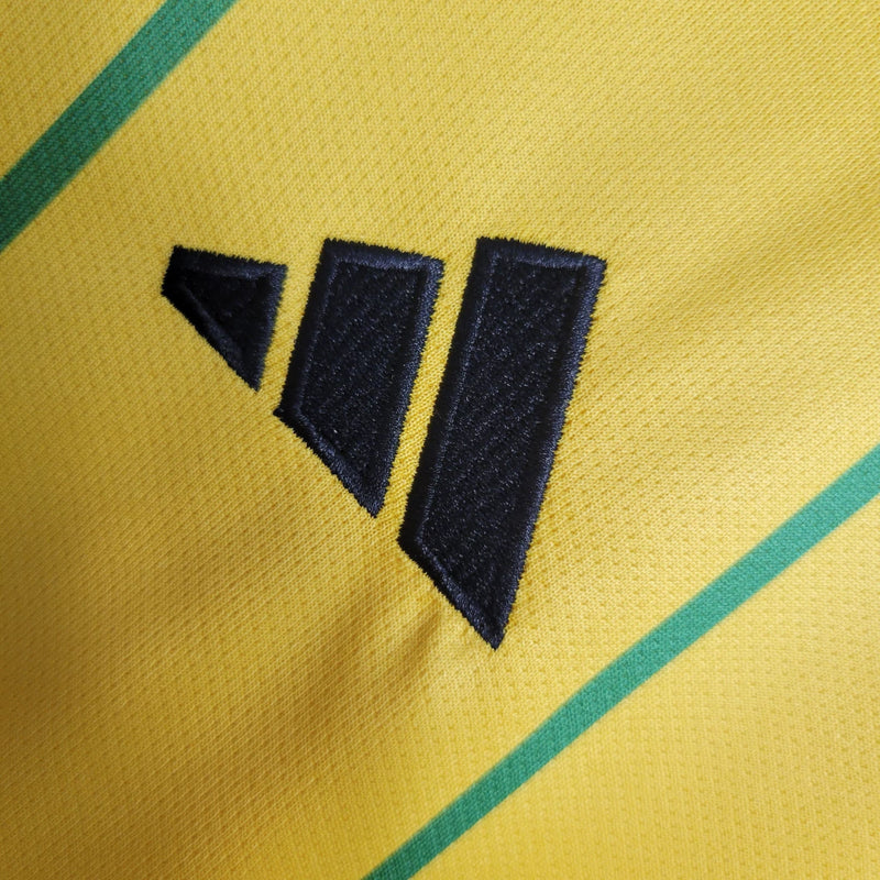 Camisa Jamaica Home I 2023/24 Adidas Torcedor Masculina amarela, uniforme principal da seleção jamaicana, detalhes em verde e preto, tecido leve e respirável, corte masculino."
camisa Jamaica Home 2023/24 amarela
camisa Adidas Jamaica torcedor masculina
uniforme principal seleção Jamaica
camisa Reggae Boyz 2023/24