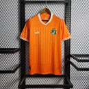 Camisa Costa do Marfim Home I 2022/23 Puma Torcedor Masculina na cor laranja – uniforme oficial dos Elefantes, modelo torcedor, tecido leve e respirável, disponível na Waze Mix."Camisa Costa do Marfim Home 2022
Camisa Costa do Marfim Puma
Camisa Costa do Marfim Laranja
Camisa Elefantes 2022/23
Camisa Costa do Marfim Torcedor Masculina
Uniforme Costa do Marfim Puma
Camisa seleção Costa do Marfim 2022
Camisa oficial Costa do Marfim