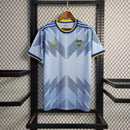Camisa Boca Juniors Third (3) 2023/24 Adidas Torcedor Masculina azul com detalhes amarelos, escudo bordado e logo Adidas estampado.