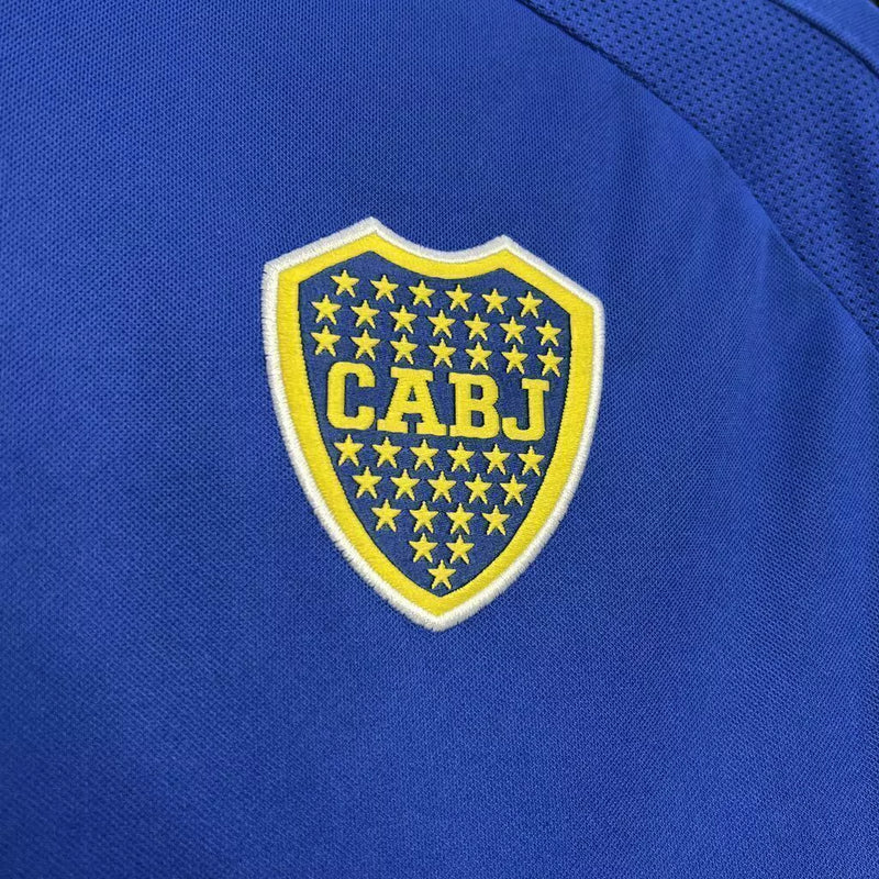 Camisa Boca Juniors Home (1) 2000/01 Nike Retrô Masculina azul com faixa amarela horizontal, escudo bordado e logo Nike estampado.