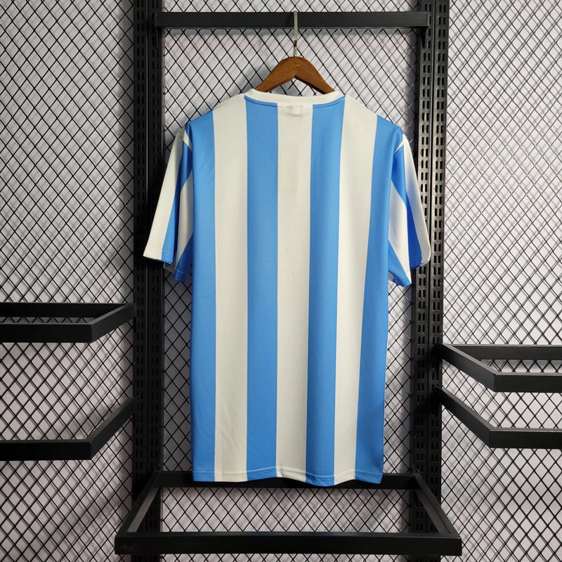 Camisa Argentina Home I 1986/87 Le Coq Sportif Retrô Masculina - uniforme histórico da seleção argentina, listras celeste e branca, gola clássica, tecido leve e respirável, perfeita para torcedores e colecionadores de futebol"