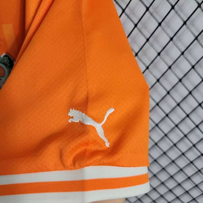 Camisa Costa do Marfim Home I 2022/23 Puma Torcedor Masculina na cor laranja – uniforme oficial dos Elefantes, modelo torcedor, tecido leve e respirável, disponível na Waze Mix."Camisa Costa do Marfim Home 2022
Camisa Costa do Marfim Puma
Camisa Costa do Marfim Laranja
Camisa Elefantes 2022/23
Camisa Costa do Marfim Torcedor Masculina
Uniforme Costa do Marfim Puma
Camisa seleção Costa do Marfim 2022
Camisa oficial Costa do Marfim