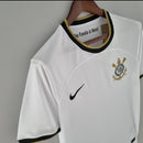 Camisa Corinthians Home I 2022/23 Nike torcedor masculina branca com detalhes pretos, escudo do clube no peito e logotipo da Nike, modelo para torcedores"