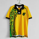 Camisa Jamaica Home I 1998/99 Kappa Retrô Masculina amarela – uniforme clássico da seleção jamaicana, modelo histórico da Copa do Mundo 1998 com detalhes verdes e pretos."