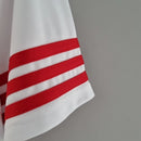 Camisa River Plate Home I 2015/16 Adidas Retrô Masculina branca com faixa diagonal vermelha, tecido leve e respirável, gola retrô clássica, escudo bordado, perfeita para torcedores, colecionadores e apaixonados pelo futebol argentino.