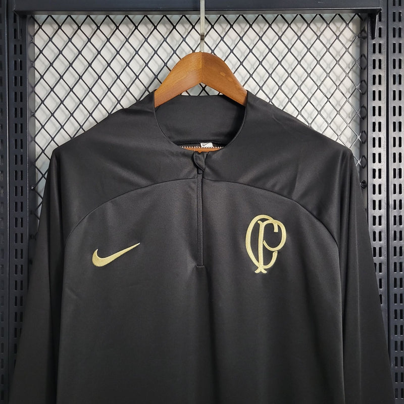 Camisa Corinthians treino 2023/24 Nike manhã longa preta com escudo dourado aplicado