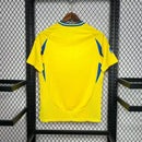 Camisa Al-Nassr Home I 2024/25 Torcedor Masculina, amarela com detalhes em azul, tecido leve e confortável, uniforme oficial do clube saudita para torcedores
