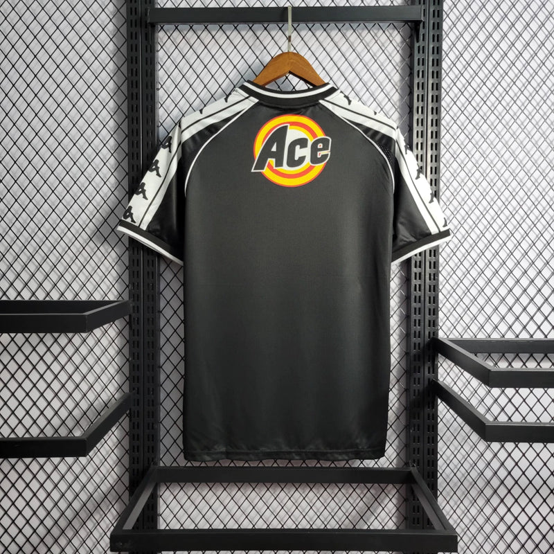 Camisa Vasco da Gama Home I 2000/01 Kappa Retrô Masculina branca com faixa diagonal preta e detalhes em vermelho, gola redonda e escudo bordado do clube.