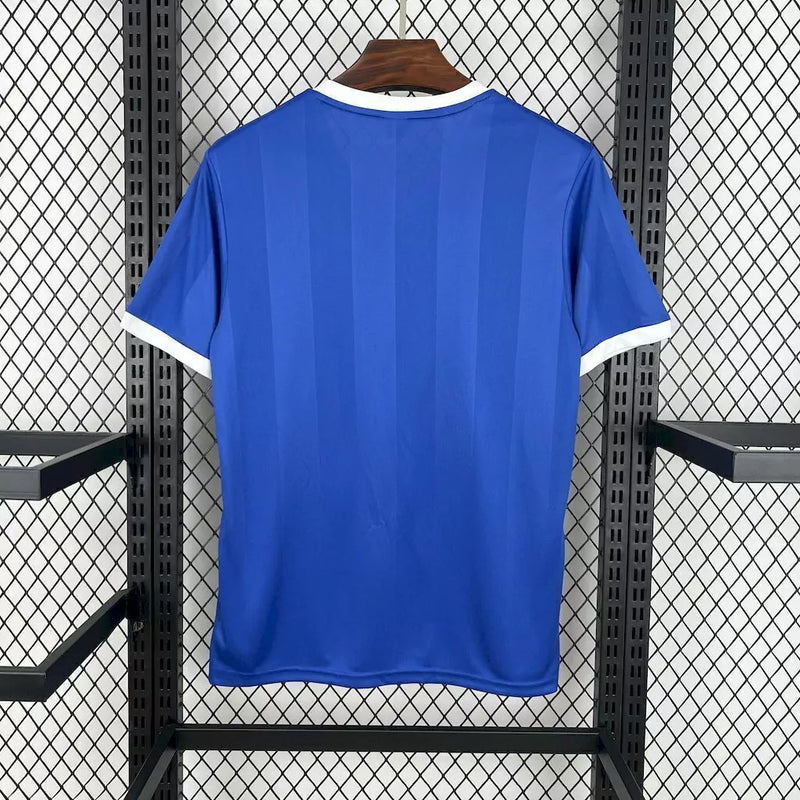 Camisa Argentina Away II 1986/87 Le Coq Sportif retrô masculina, azul escuro com detalhes em branco, escudo da AFA bordado no peito, gola clássica e mangas tradicionais, modelo histórico da seleção argentina após a Copa do Mundo de 1986.