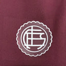 Camisa Lanús Home I 2025/26 Umbro Torcedor Masculina na cor vinho, modelo oficial para torcedores, com escudo do clube no peito e design clássico do time argentino."