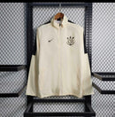 Jaqueta corta vento Corinthians 2024/25 Nike masculino na cor bege com escudo bordado no peito 