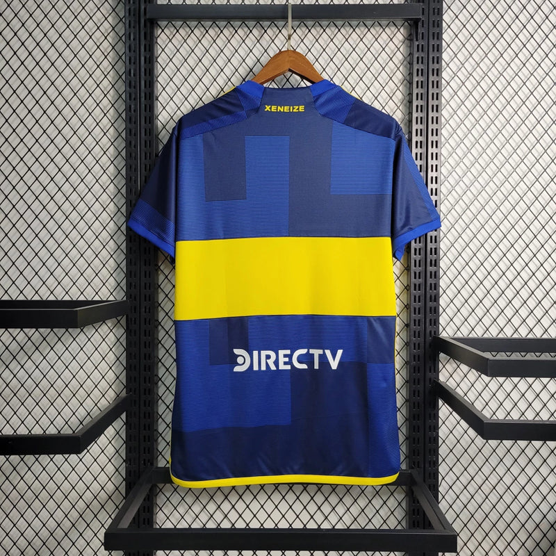 "Camisa Boca Juniors Home (1) 2023/24 Adidas Torcedor Masculina azul com faixa amarela, escudo bordado e tecnologia AEROREADY"
