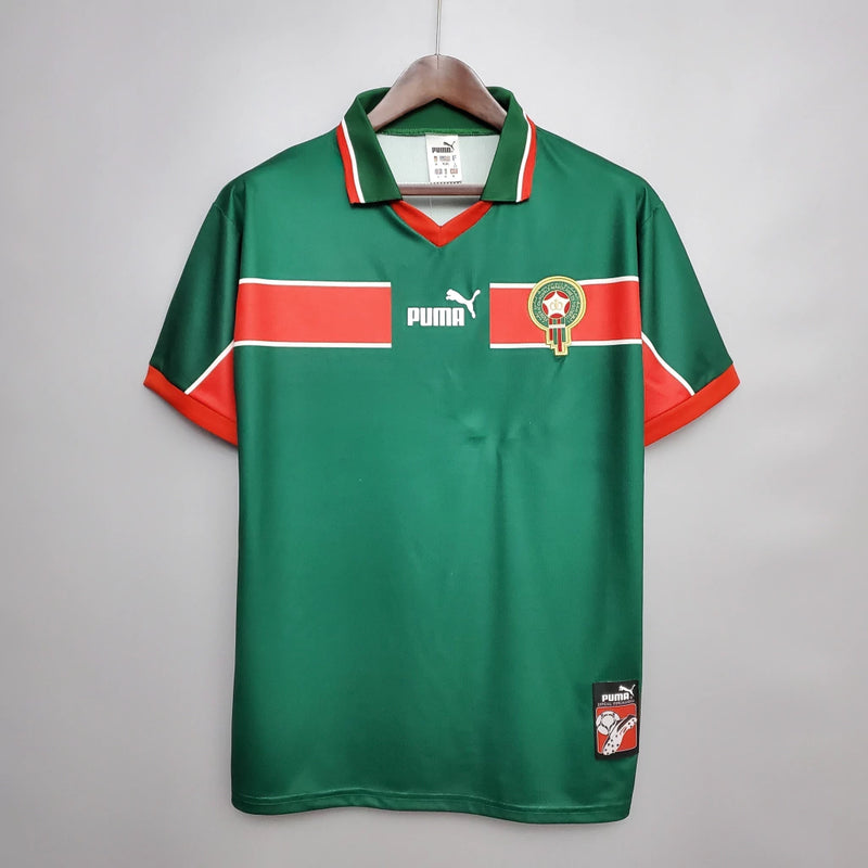 Camisa Marrocos Home I 1998/99 Puma Retrô Masculina verde, modelo clássico dos Leões do Atlas dos anos 90, design nostálgico e histórico para colecionadores e fãs de futebol retrôCamisa Marrocos Retrô
Camisa Marrocos 1998/99
Camisa Puma Marrocos antiga
Camisa Marrocos verde retrô
Camisa Marrocos Home 1998
Camisa retrô masculina Marrocos
Camisa de futebol retrô Marrocos
Camisa clássica Marrocos 1999
Camisa Leões do Atlas retrô