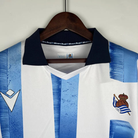 Camisa Real Sociedad Home I 2023/24 Torcedor Masculina - Branca e Azul