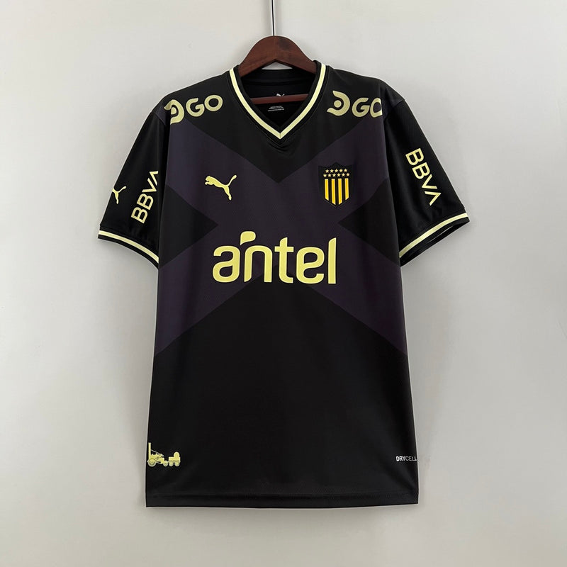 Camisa Peñarol Away II 2023/24 Torcedor Masculina Preta, uniforme uruguaio Puma, escudo bordado, tradição carbonera, conforto e estilo para torcedores"