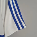 Camisa Universidad Católica Home I 1984/85 Adidas Retrô Masculina branca, modelo clássico dos anos 80 com detalhes em azul, escudo bordado e design histórico do futebol chileno.