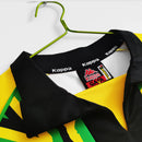 Camisa Jamaica Home I 1998/99 Kappa Retrô Masculina amarela – uniforme clássico da seleção jamaicana, modelo histórico da Copa do Mundo 1998 com detalhes verdes e pretos."