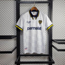 Camisa Boca Juniors Away (2) 1992/96 Olan Retrô Masculina azul escura com faixa amarela horizontal, gola polo com botões e escudo bordado clássico.
