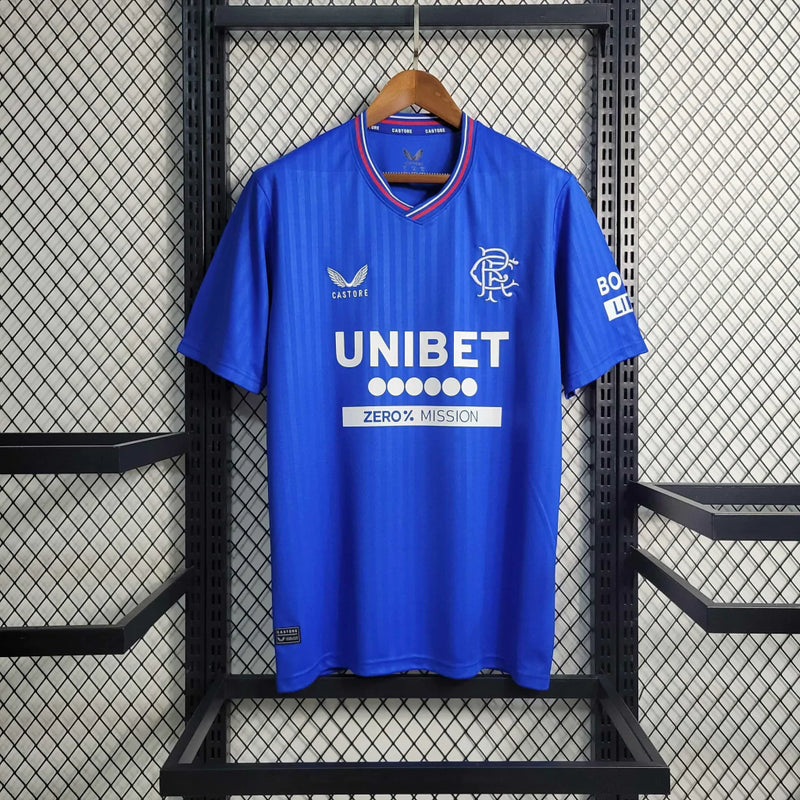 Camisa Rangers FC Home I 2023/24 Castore Torcedor Masculina Azul, uniforme moderno do clube escocês com escudo bordado e design elegante.