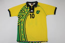 Camisa Jamaica Home I 1998/99 Kappa Retrô Masculina amarela – uniforme clássico da seleção jamaicana, modelo histórico da Copa do Mundo 1998 com detalhes verdes e pretos."