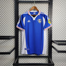 Camisa Iugoslávia 2000/01 Adidas retrô masculina azul com detalhes em branco e vermelho, gola polo com botão e mangas curtas, modelo clássico em tecido leve para torcedores e colecionadores"